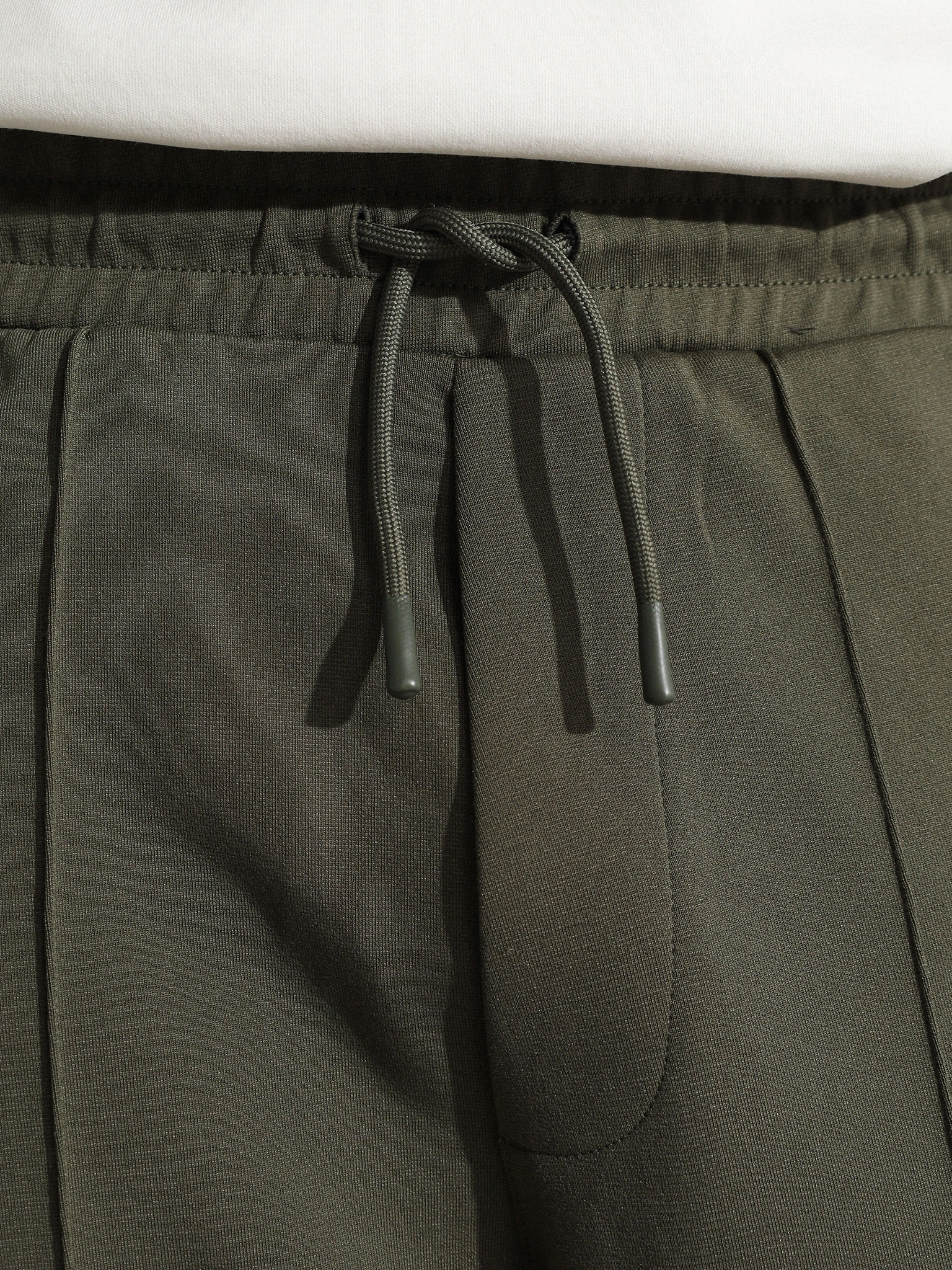 Брюки трикотажные зеленого цвета с лампасами из смесового хлопка